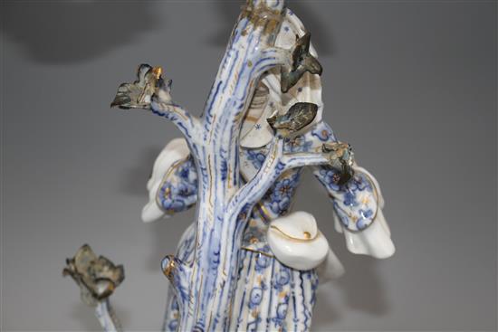 A pair of Meissen porcelain candelabra, modelled with lady and gallant stems, height 46cm